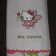 Bath towel with embroidered Hello Kitty on it