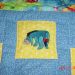Embroidered sad Eeyore on baby quilt