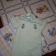 Old toys designs embroidered on quilt and baby romper