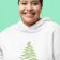 bella canvas cropped hoodie with christmas tree free embroidery design featuring joyful woman