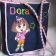 Black bag embroidered with Dora design