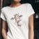 woman wearing a t shirt with crazy cow embroidery design