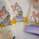 Embroidered baby wear with Little Daisy Duck design on it
