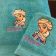 Bath towel with embroidered Elsa on it