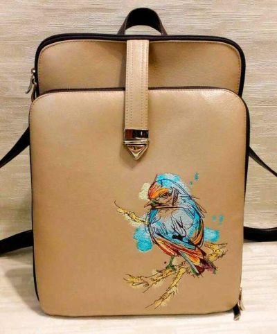 Embroidered leather bag with bird