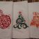 Three towels with Christmas machine embroidery designs