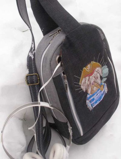 Embroidered backpack with dog pirate design