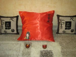 Bright red embroidered pillowcase with geisha on it