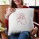 smiling woman holding pillow with santa claus free embroidery design