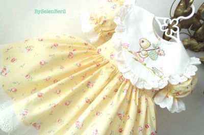 Embroidered dress with baby duck design