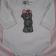 White baby wear with embroidered girl bear on it