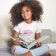 little black girl wearing t-shirt with barbie embroidery design