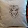 Embroidered cushion with white tiger free embroidery design
