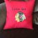 Embroidered pillow with Blackhawk logo
