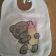 Baby bib with embroidered tiny tatty teddy on it