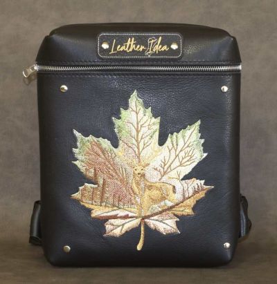 Embroidered leather bag with deer design