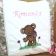 Embroidered pillow with teddy bear design