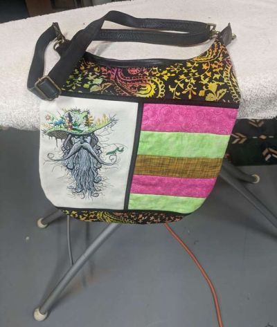 Embroidered bag with fantasy man design