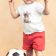 Embroidered t-shirt of a toddler standing by a soccer ball
