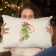 Embroiered pillow of a beautiful girl holding a pillow with a christmas