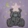 Purple baby bib embroidered with tatty teddy design