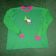 Hello Kitty Christmas design embroidered on green shirt