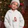 Embroidered pullover hoodie girl in front of a christmas tree