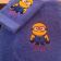 Embroidered minion in goggles on blue towel