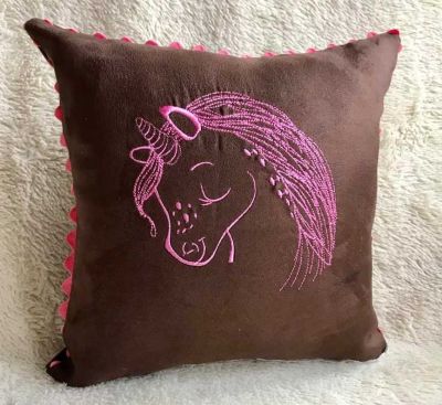 Embroidered cushion with funny unicorn design