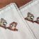 Napkin with chip and dale embroidery design