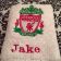 Embroidered bath towel with Liverpool Football Club logo on it