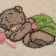 Teddy Bear with rattle design on embroidered baby quilt