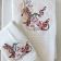 Two embroidered towels with humming bird design