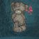 Shy teddy bear embroidered on towel