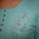 Swirl flower design on shirt embroidered
