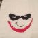 Joker's smile embroidered on towel