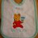Baby bib embroidered with baby Winnie the Pooh