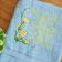 Blue embroidered towel with flower