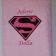 Bath towel with pink Superman logo embroidery design